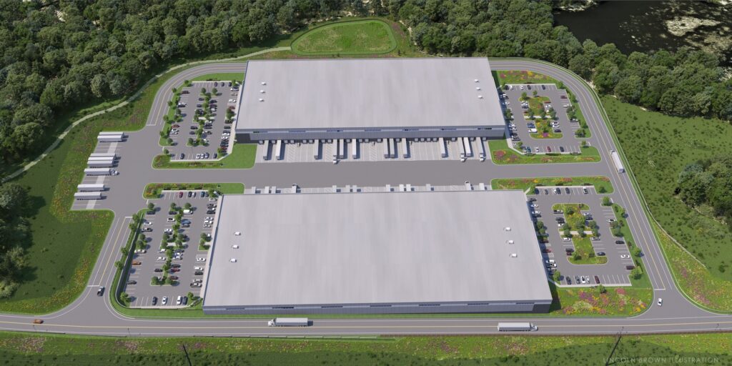Aerial view of two large, rectangular warehouse buildings surrounded by parking lots and greenery. Each building has multiple loading docks and parked trucks. Trees and a pond are visible in the background.