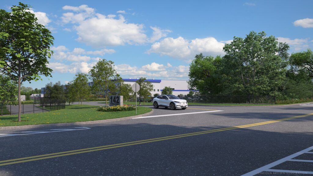 A white car drives on a road towards a large, white building in the background. Trees and greenery surround the area, and the sky is partly cloudy. A sign with the number 142 is seen near the road.